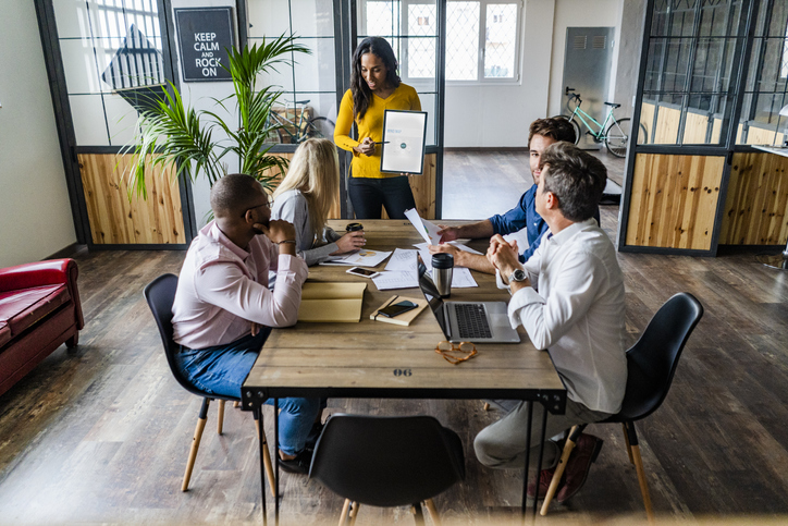Businesswoman leading a presentation in loft office